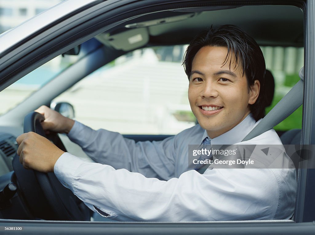 Side profile of a businessman in a car