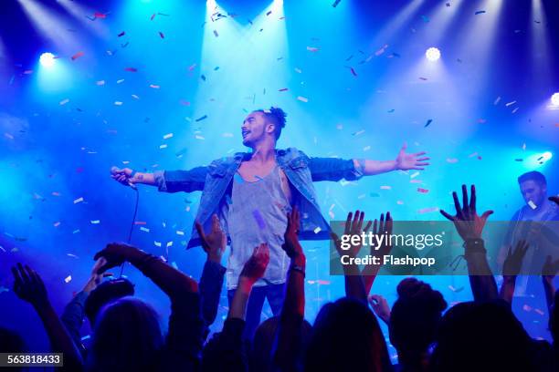 band performing on stage at music concert - artista imagens e fotografias de stock