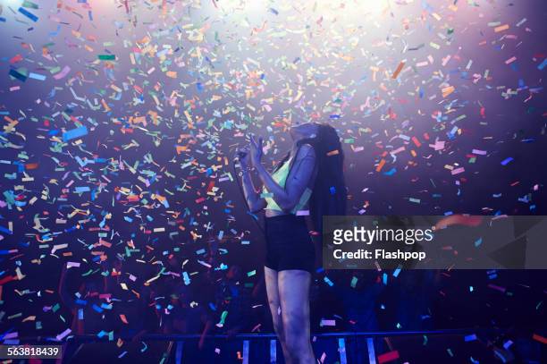 band performing on stage at music concert - woman microphone stock pictures, royalty-free photos & images