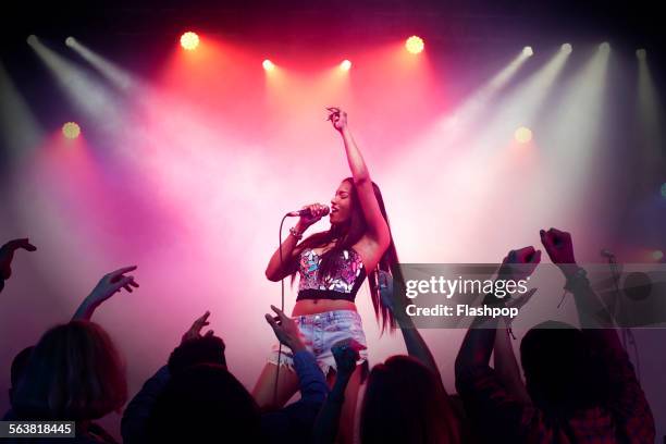 band performing on stage at music concert - performer silhouette stock pictures, royalty-free photos & images