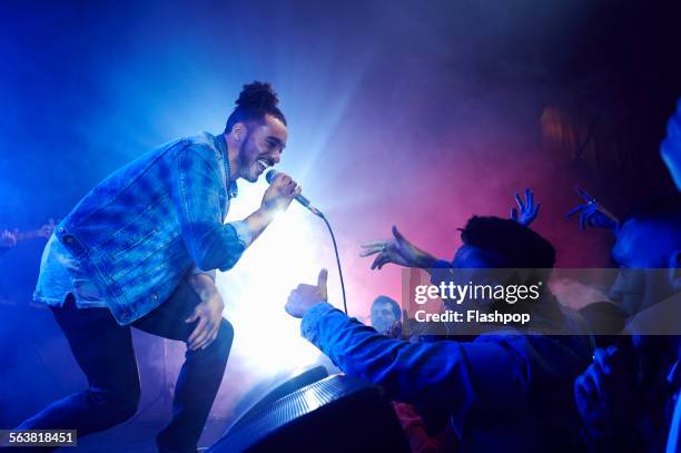 band performing on stage at music concert - concert singer stock pictures, royalty-free photos & images