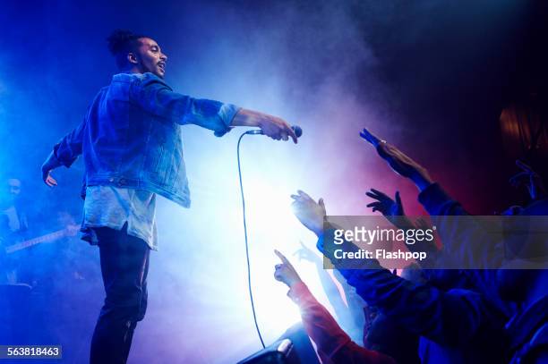 band performing on stage at music concert - concert imagens e fotografias de stock