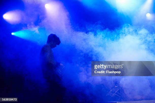 guitarist performing on stage at music concert - blues musicians stock pictures, royalty-free photos & images