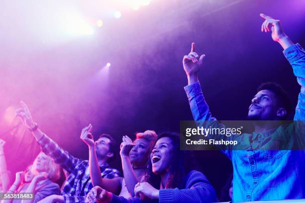 crowd of people at music concert - aufregung stock-fotos und bilder