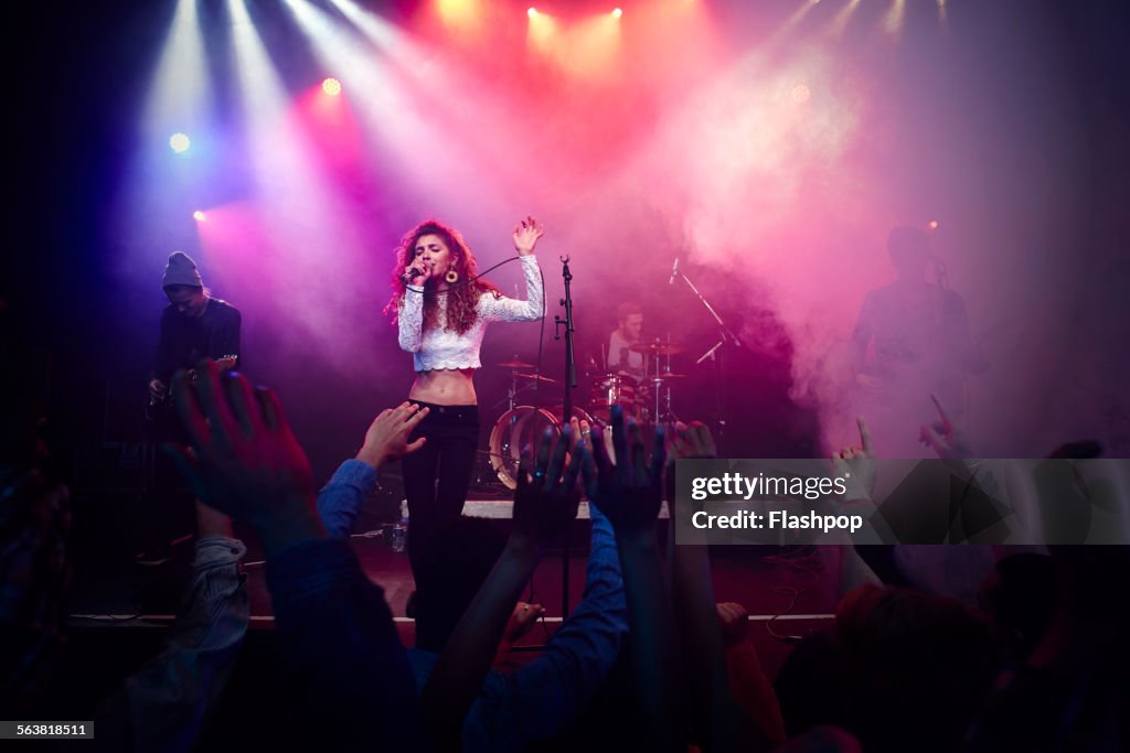 Band performing on stage at music concert