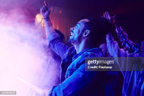 crowd of people at music concert - concierto fotografías e imágenes de stock