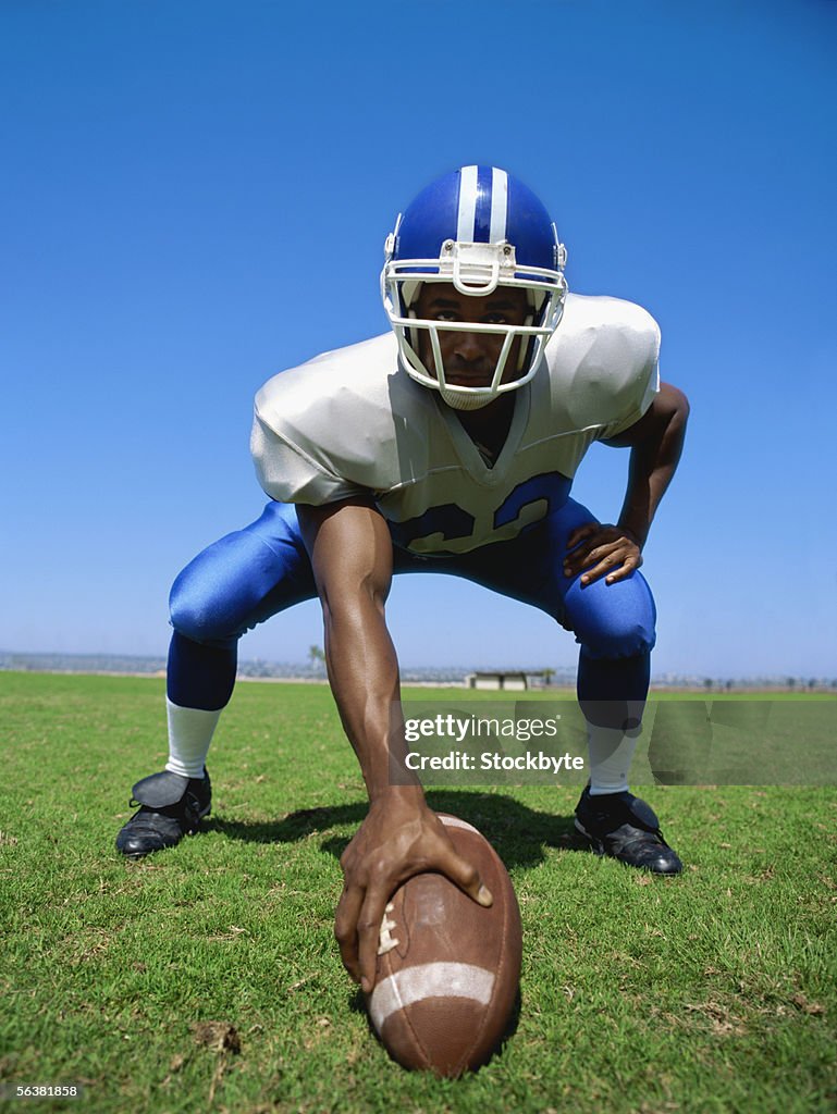 Football player playing on a football field