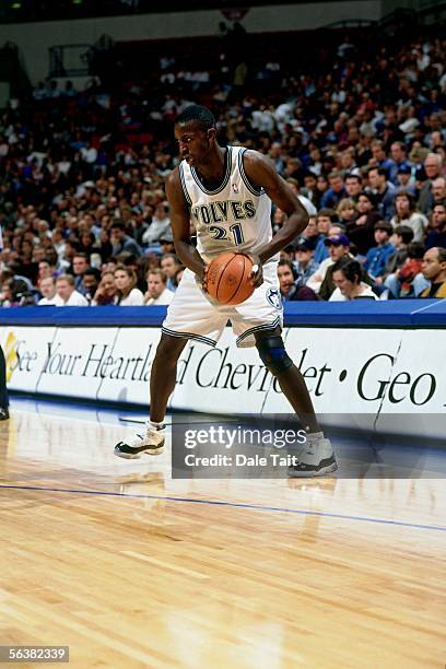 Kevin Garnett of the Minnesota Timberwolves looks to make a move against the Seattle Sonics during an NBA game at the Target Center on November 22,...