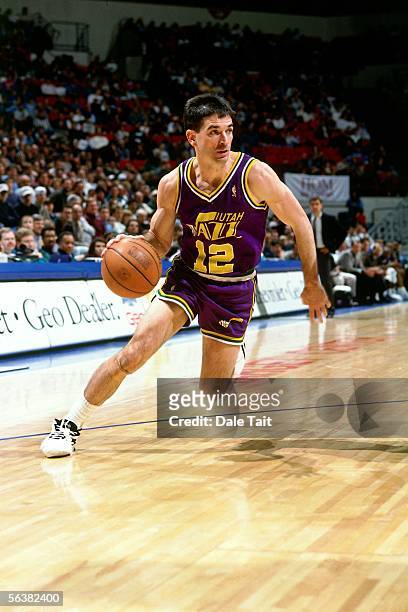 John Stockton of the Utah Jazz drives to the basket against the Minnesota Timberwolves during an NBA game on November 18, 1996 at the Target Center...
