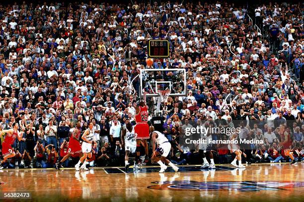 Michael Jordan of the Chicago Bulls shoots the game-winning jumpshot over Byron Russell of the Utah Jazz during Game Six of the 1998 NBA Finals on...