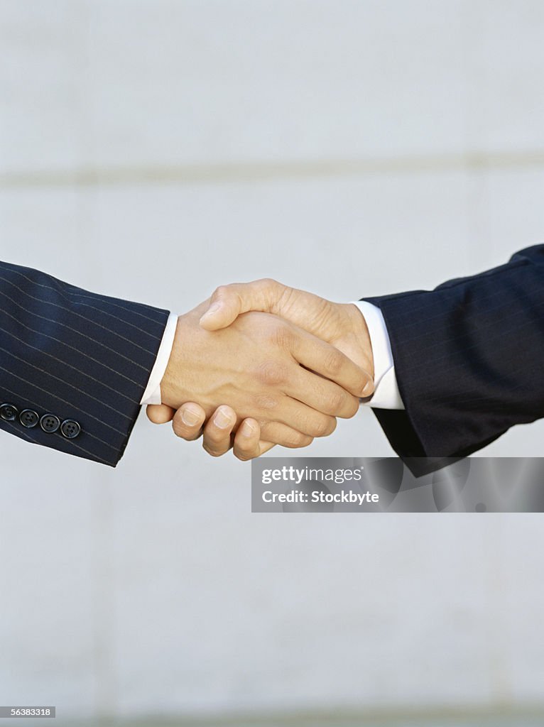 Two businessmen shaking hands