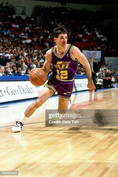 John Stockton of the Utah Jazz drives to the basket against the Minnesota Timberwolves during an NBA game on November 18, 1996 at the Target Center...