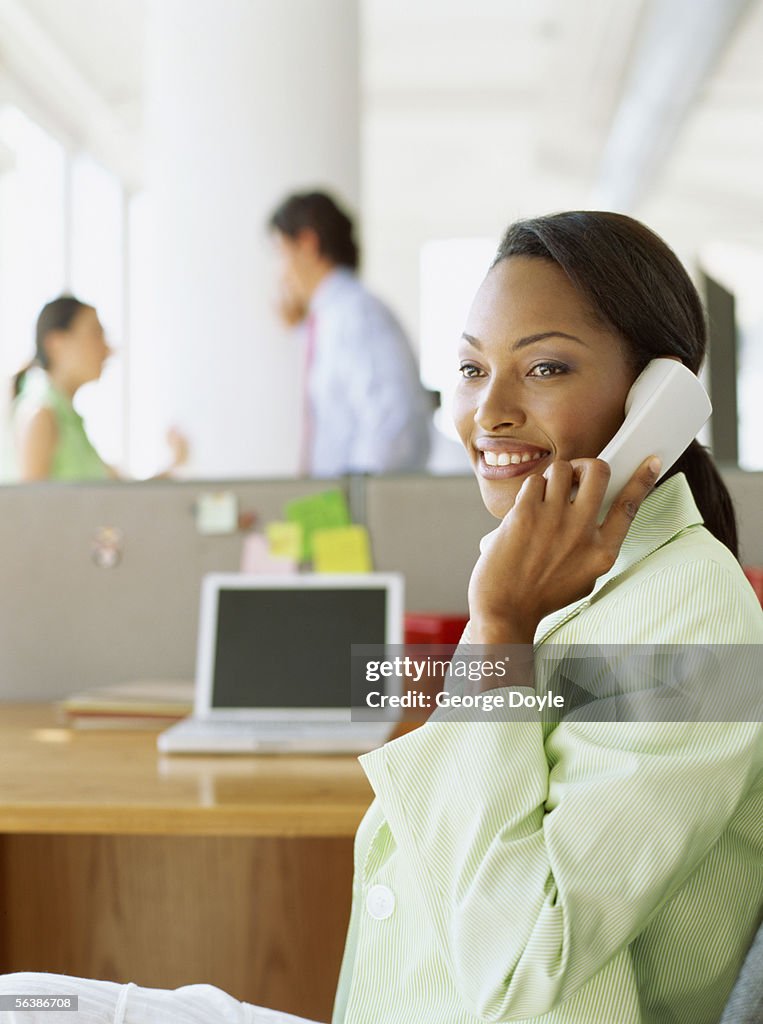 Businesswoman talking on the phone in an office