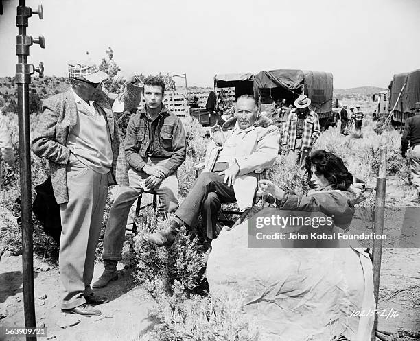 Director George Cukor in discussion with his crew on the set of the film 'Wild is the Wind', for Paramount Pictures, 1957.