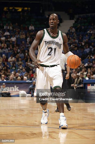 Kevin Garnett of the Minnesota Timberwolves moves the ball during a game against the Charlotte Bobcats at Target Center on November 19, 2005 in...