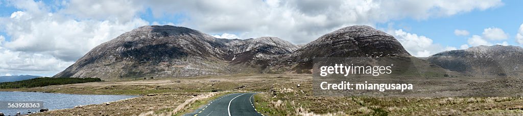 Panorama of a landscape of mountains and a road