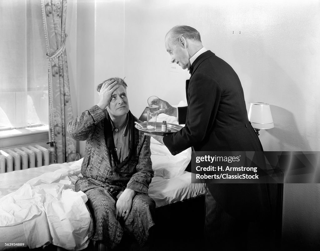 1930s 1940s MAN SIT ON BED...