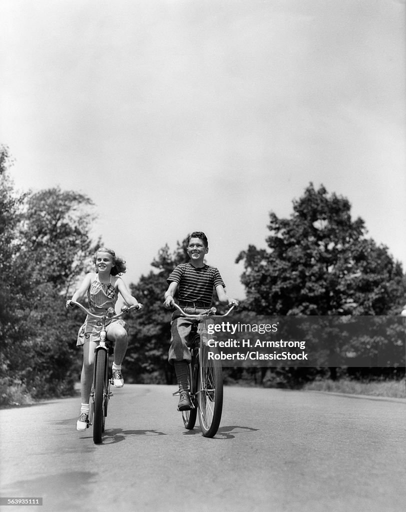 1940s BOY GIRL RIDING...