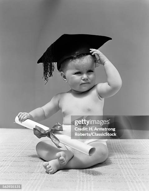 1940s BABY WEARING MORTAR BOARD GRADUATION CAP AND HOLDING DIPLOMA