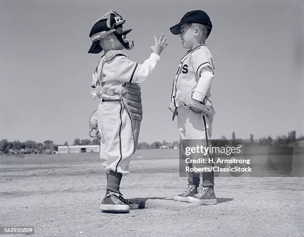 1960s BOY LITTLE LEAGUER PITCHER ARGUING WITH CATCHER