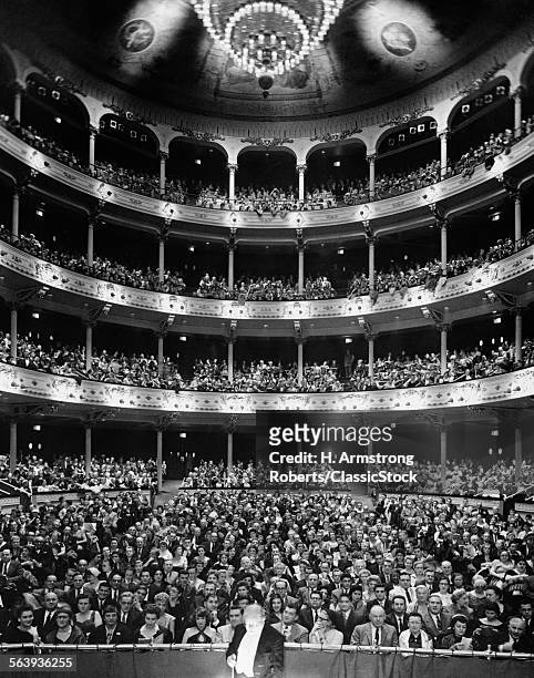 1960s THEATER AUDIENCE SEATED VIEW FROM THE STAGE CONDUCTOR IN ORCHESTRA PIT