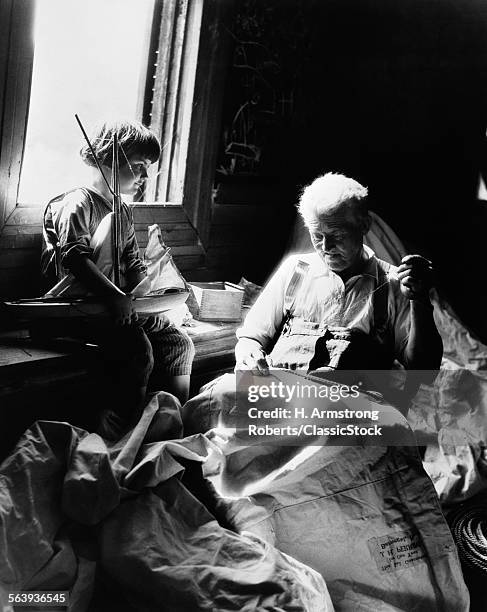 1930s BOY HOLDING TOY SAILBOAT WATCHING GRANDFATHER SEW SAIL