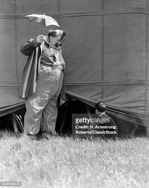 1930s MAN CLOWN CATCHING LITTLE BOY PEEKING UNDER CIRCUS BIG TOP TENT