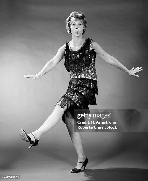 1960s WOMAN IN FLAPPER COSTUME DANCING