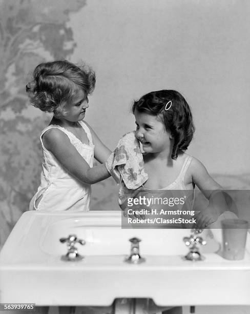 1930s TWO GIRLS SISTERS AT BATHROOM SINK