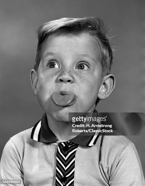1960s PORTRAIT BOY WITH BLOND HAIR & FRECKLES STICKING TONGUE OUT