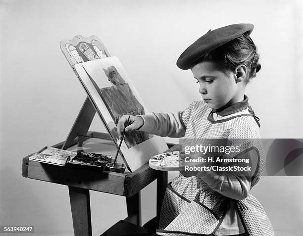 1960s LITTLE GIRL ARTIST SITTING AT EASEL PAINTING