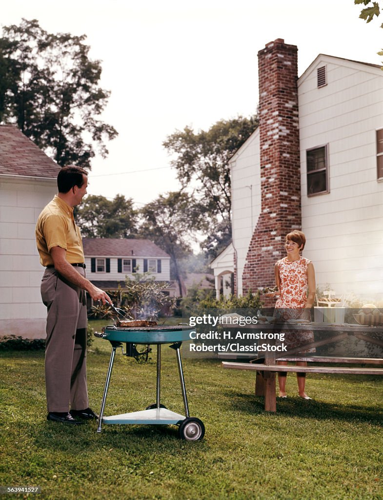 1960s COUPLE SUBURBAN...