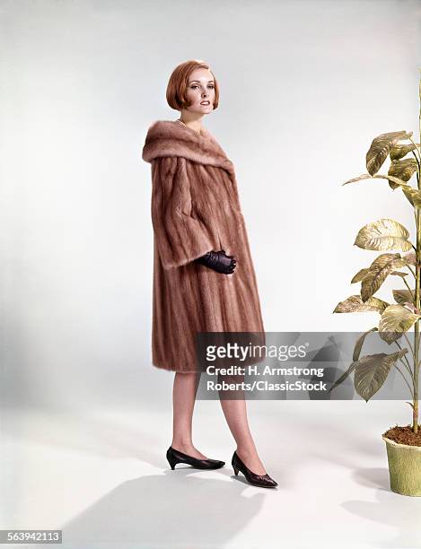 1960s WOMAN WEARING FUR MINK COAT