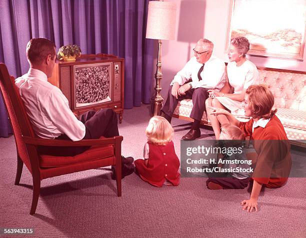 1960s 1970s FAMILY FATHER MAN MOTHER WOMAN SON BOY DAUGHTER GIRL GRANDFATHER GRANDMOTHER WATCHING TELEVISION