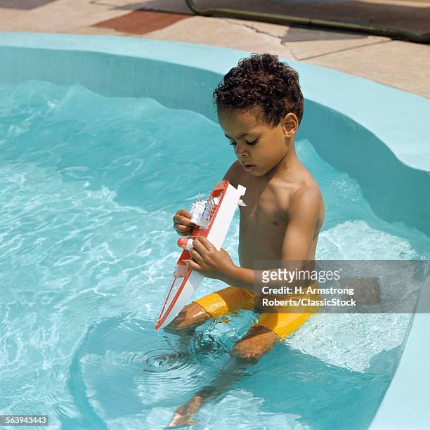1970s CHILD AFRICAN AMERICAN POOL TOY BOAT