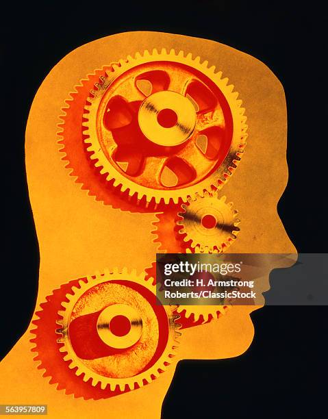 1970s SYMBOLIC IDEA YELLOW SILHOUETTED PROFILE ANONYMOUS MALE HEAD FILLED WITH INDUSTRIAL MACHINE GEARS