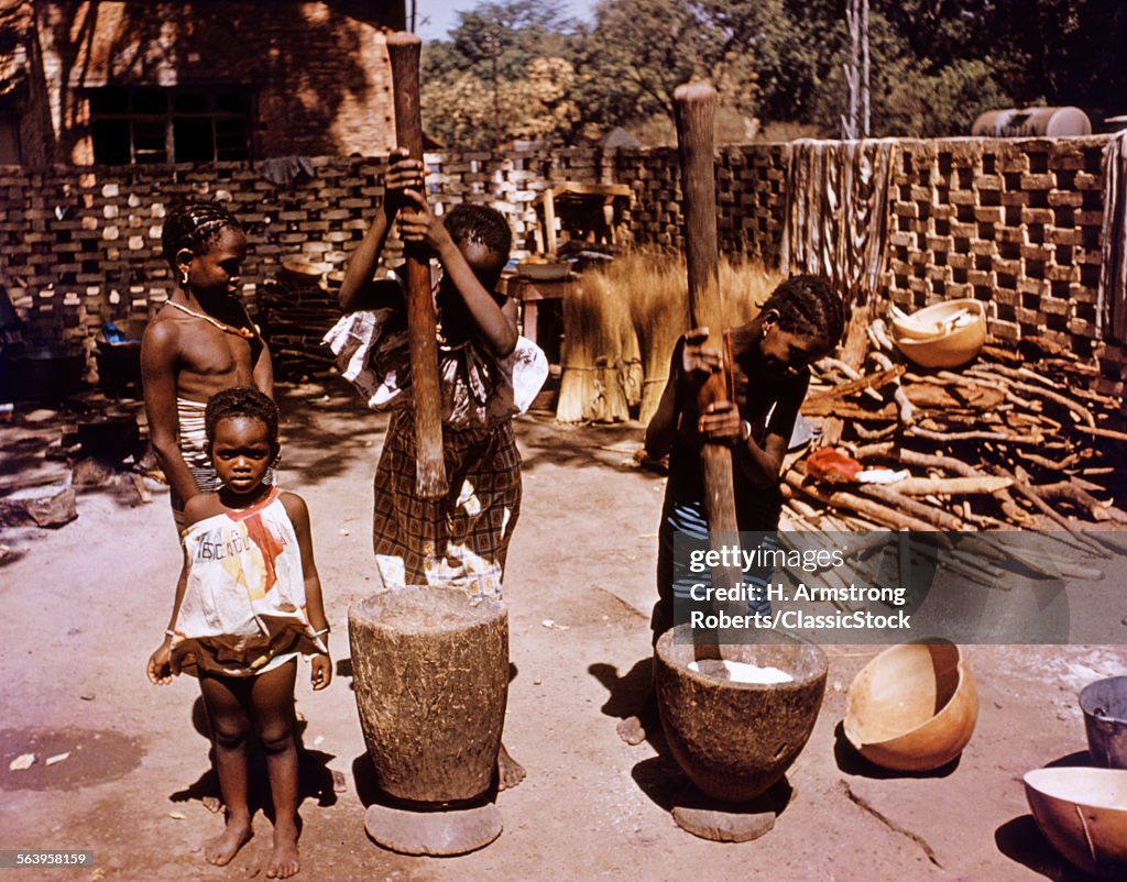 1980s TWO WOMEN GRINDING...