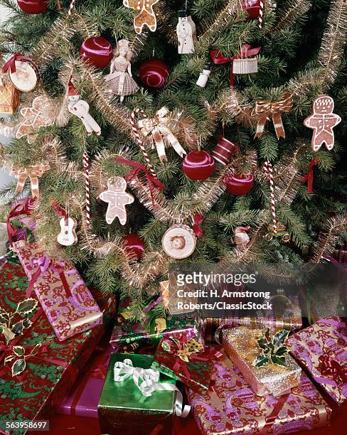 1980s WRAPPED PRESENTS UNDER TRADITIONAL CHRISTMAS TREE STILL LIFE