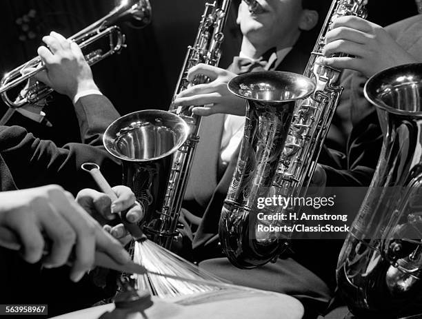 1960s HANDS OF ANONYMOUS JAZZ COMBO PLAYING SAXOPHONES TRUMPET AND CYMBAL WITH WIRE BRUSH DRUMSTICK