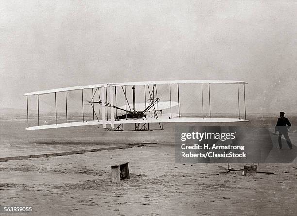 1903 WRIGHT BROTHERS' PLANE TAKING OFF AT KITTY HAWK NORTH CAROLINA USA