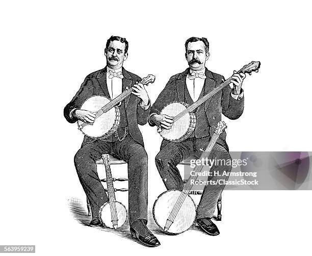 1880s 1890s TWO MEN PLAYING CLASSICAL STYLE FIVE STRING BANJOS SITTING SIDE BY SIDE LOOKING AT CAMERA