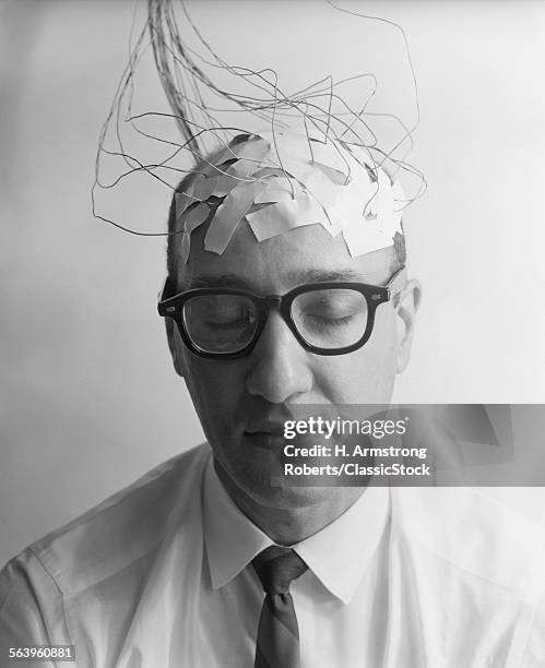 1960s PORTRAIT OF MAN CHARACTER WITH WIRES TAPED TO BALD HEAD