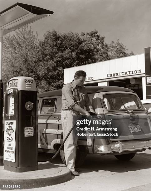 1950s SERVICE STATION ATTENDANT MAN FILLING GAS TANK OF WOOD BODY STATION WAGON