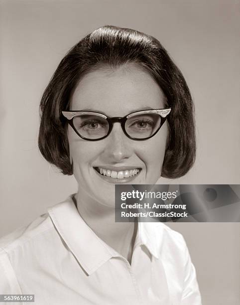 1960s SMILING PORTRAIT WOMAN WEARING HORN-RIMMED GLASSES LOOKING AT CAMERA