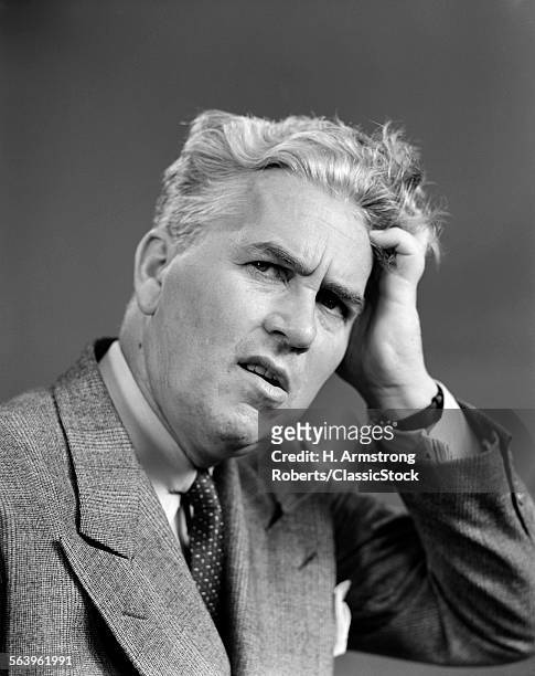 1930s 1940s MAN PORTRAIT HAND HELD UP TO HEAD FACIAL EXPRESSION FORGETFUL CONFUSED CONTEMPLATIVE SUIT TIE BUSINESS