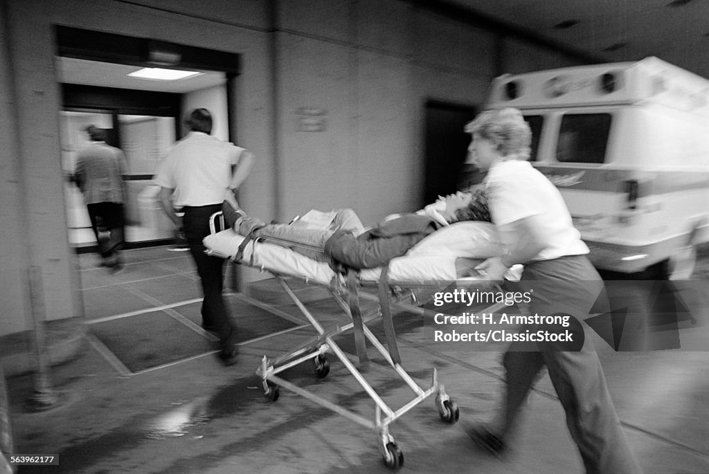 1980s EMT TEAM RUSHING...