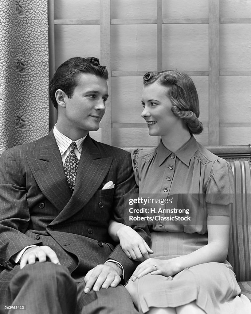 1930s 1940s COUPLE SITTING...