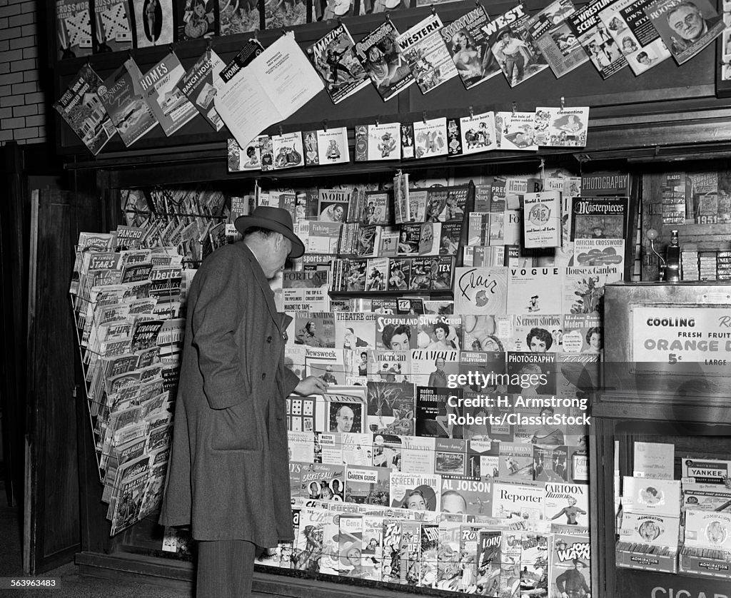 1950s NEWSSTAND WITH MAN...