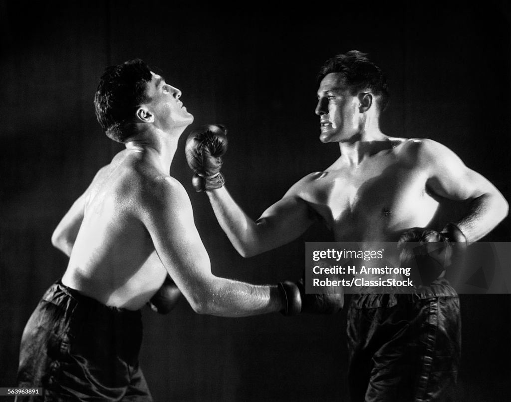 1930s MAN IN BOXING MATCH...