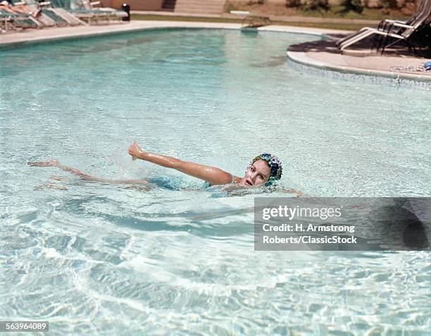 1960s WOMAN BLUE BATHING CAP SWIMMING IN WATER POOL OVERHAND STROKE